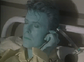 Gif of David Bowie looking a bit blue in his Loving the Alien video