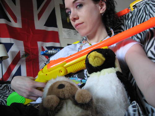 Amber with nerf gun and stuffed hunting companions