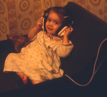 Toddler Amber listening to old headphones